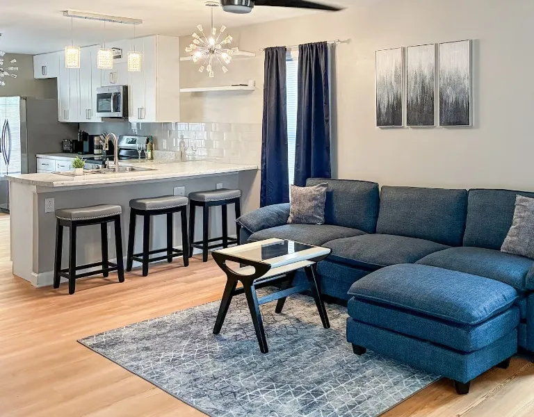 Bright shared living area with open kitchen
